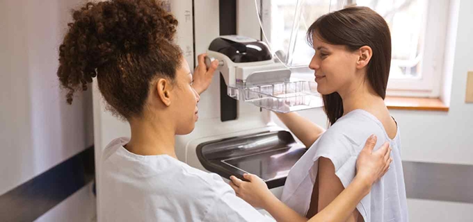 Female patient getting mammogram
