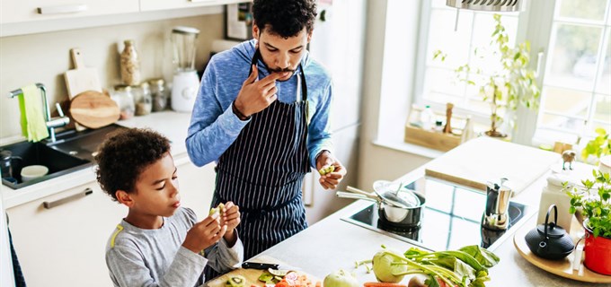 Father and son baking a recipe in the kitchen